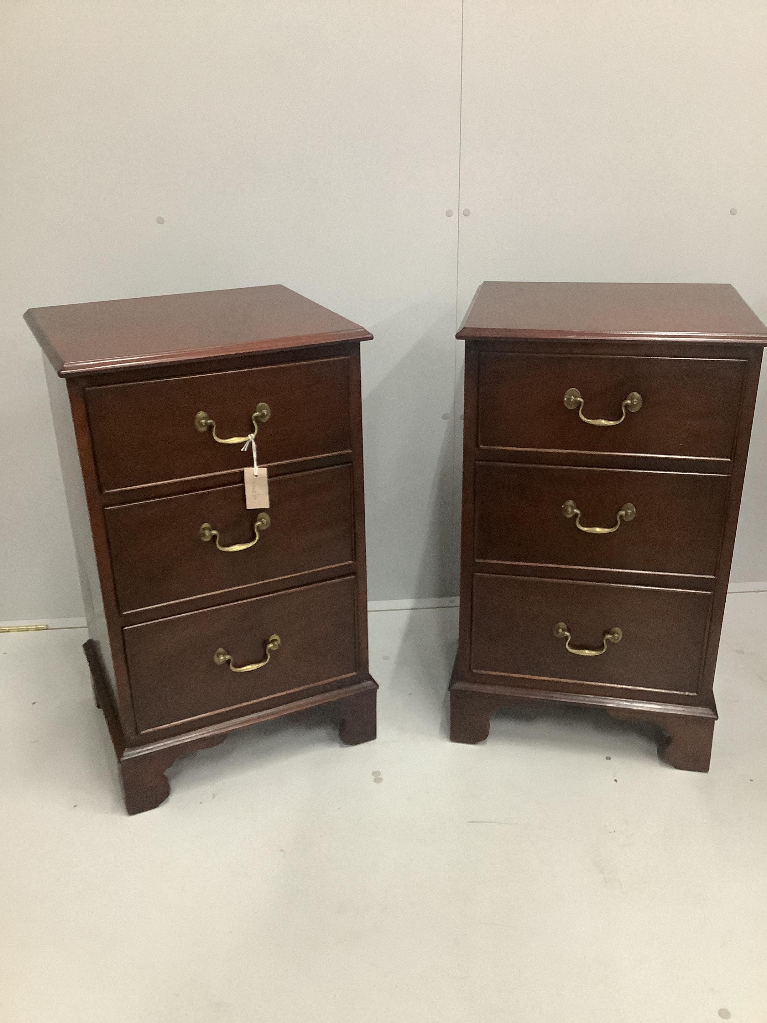 A pair of George III style mahogany three drawer bedside chests, width 47cm, depth 39cm, height 80cm